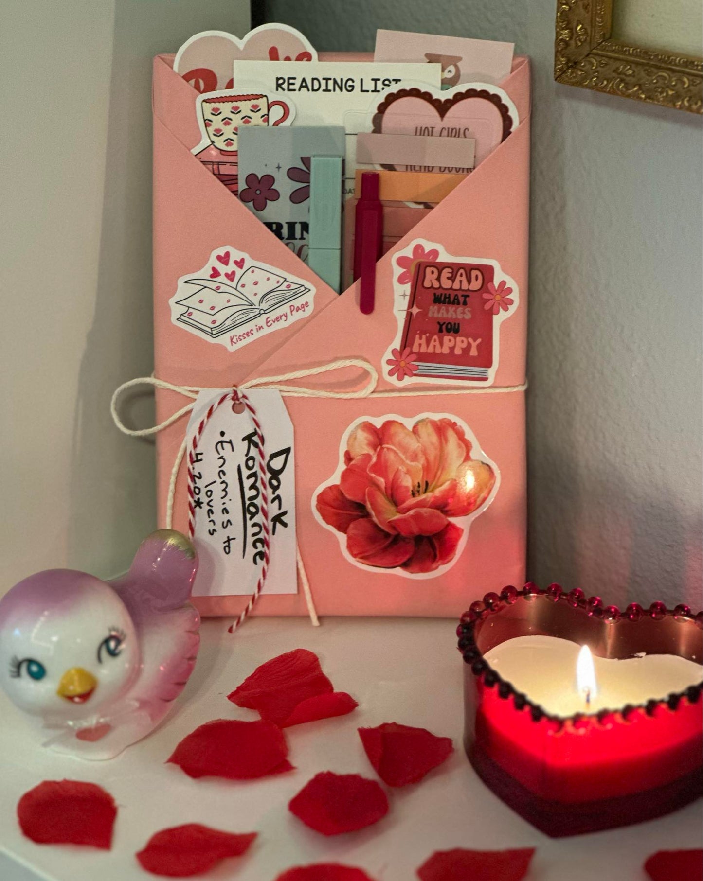 Pink wrapped dark romance blind date with a book and bookish accessories