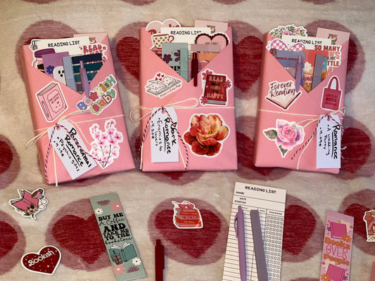 Three romance blind date with a book in pink wrapping trimmed with cute book accessories and stickers